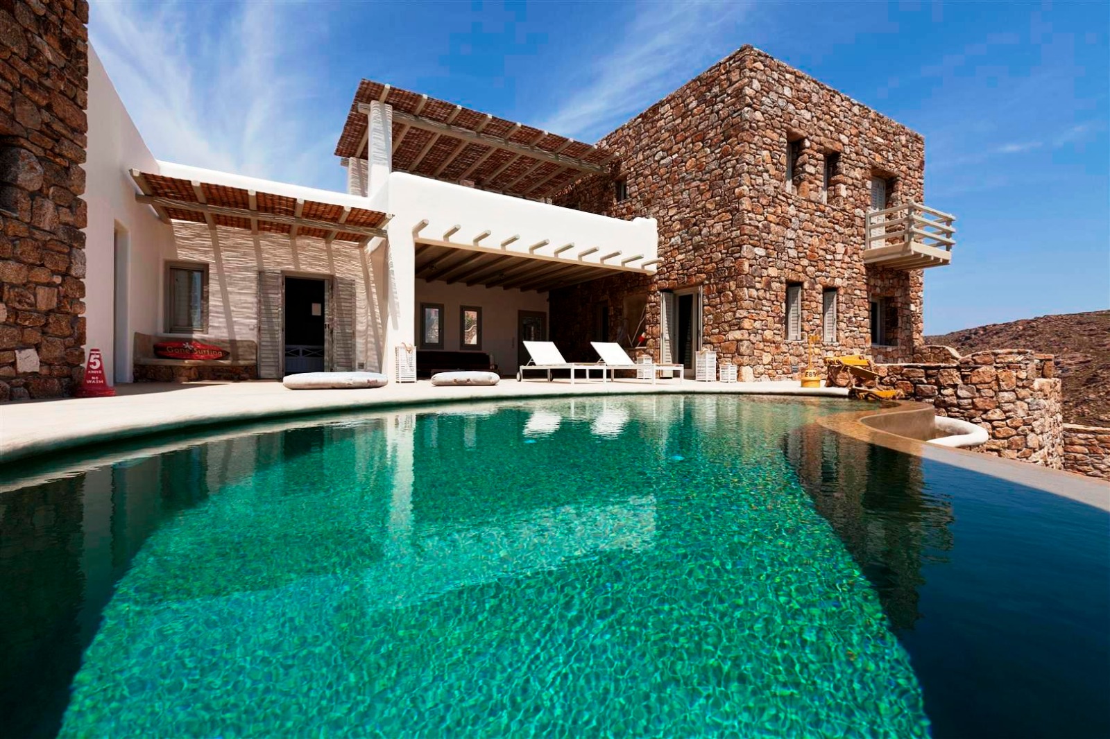 Luxury Mykonos villa rental with private pool and stone architecture