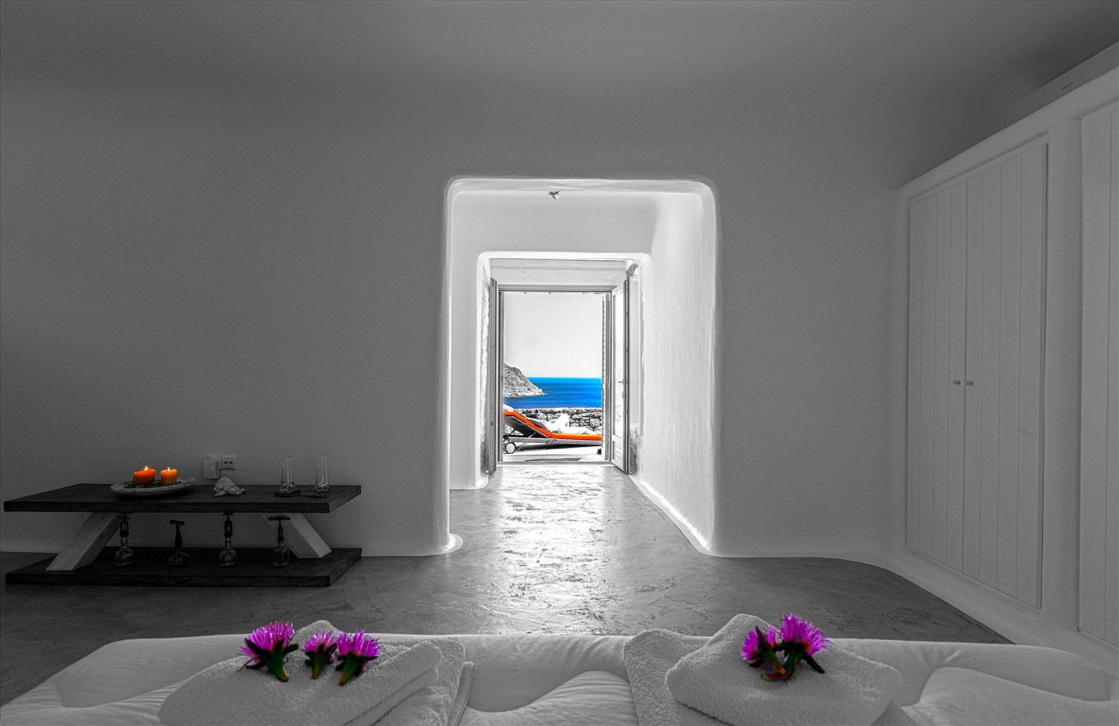 Interior of a luxury Mykonos holiday villa with Cycladic arched hallway